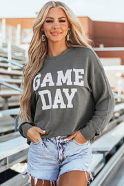 Gray ribbed sweatshirt with white GAME DAY graphic, crew neck, long sleeves.