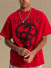 Red oversized t-shirt with a black serpent graphic and text.