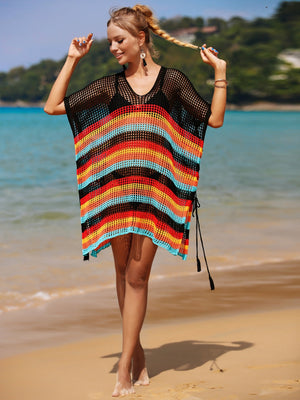 Rainbow stripe crochet beach poncho with black mesh and tassel ties.
