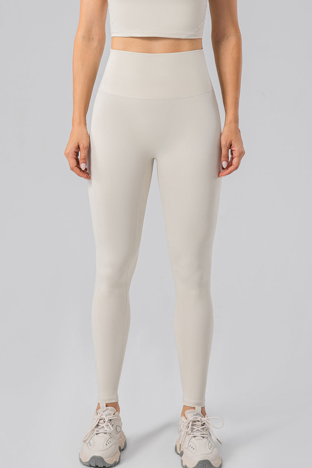 Sculpted Contour High-Waist Performance Leggings in Ivory with a seamless waistband.
