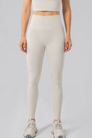 Sculpted Contour High-Waist Performance Leggings in Ivory with a seamless waistband.