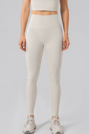 Sculpted Contour High-Waist Performance Leggings in Ivory with a seamless waistband.