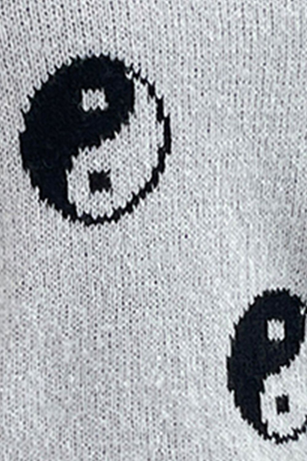 Light gray acrylic knit sweater with black yin yang pattern