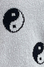 Light gray acrylic knit sweater with black yin yang pattern