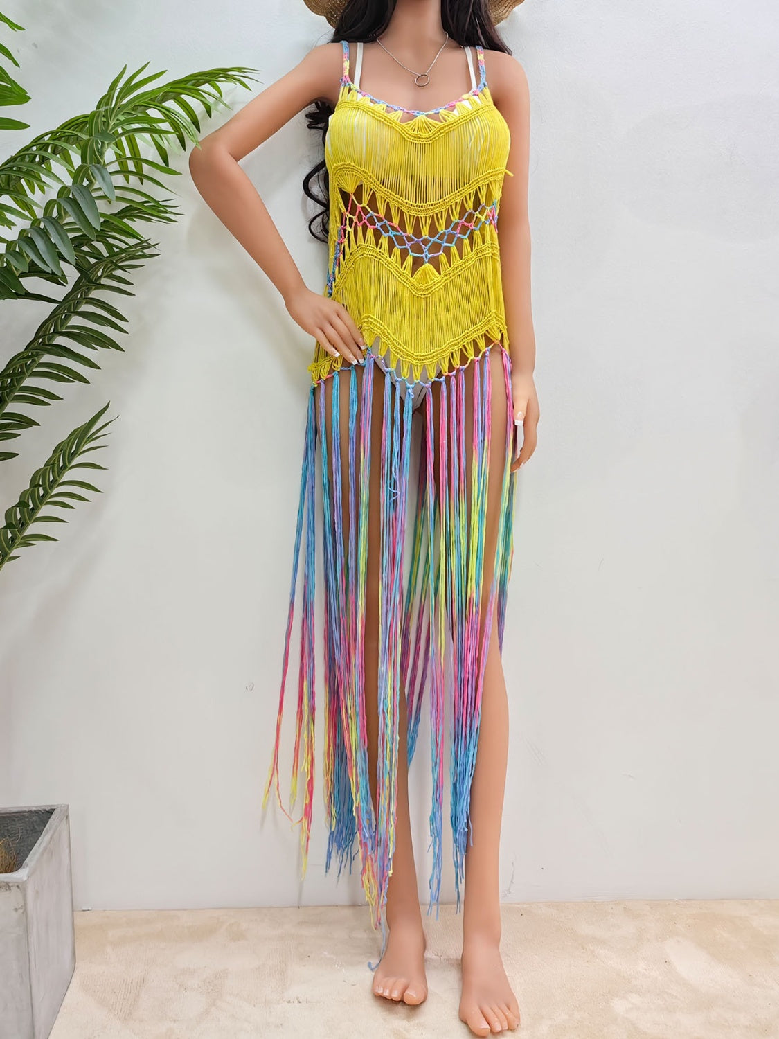 Yellow crochet cover-up dress with rainbow fringe and open knit detail.