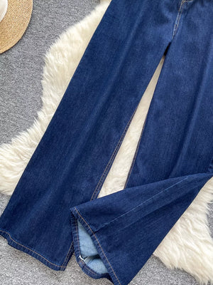 Dark wash maternity jeans with wide legs and a high rise, shown up close.