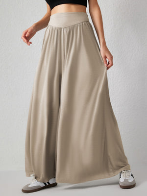 Khaki jersey wide-leg trousers with drape-front detail and elastic waistband.