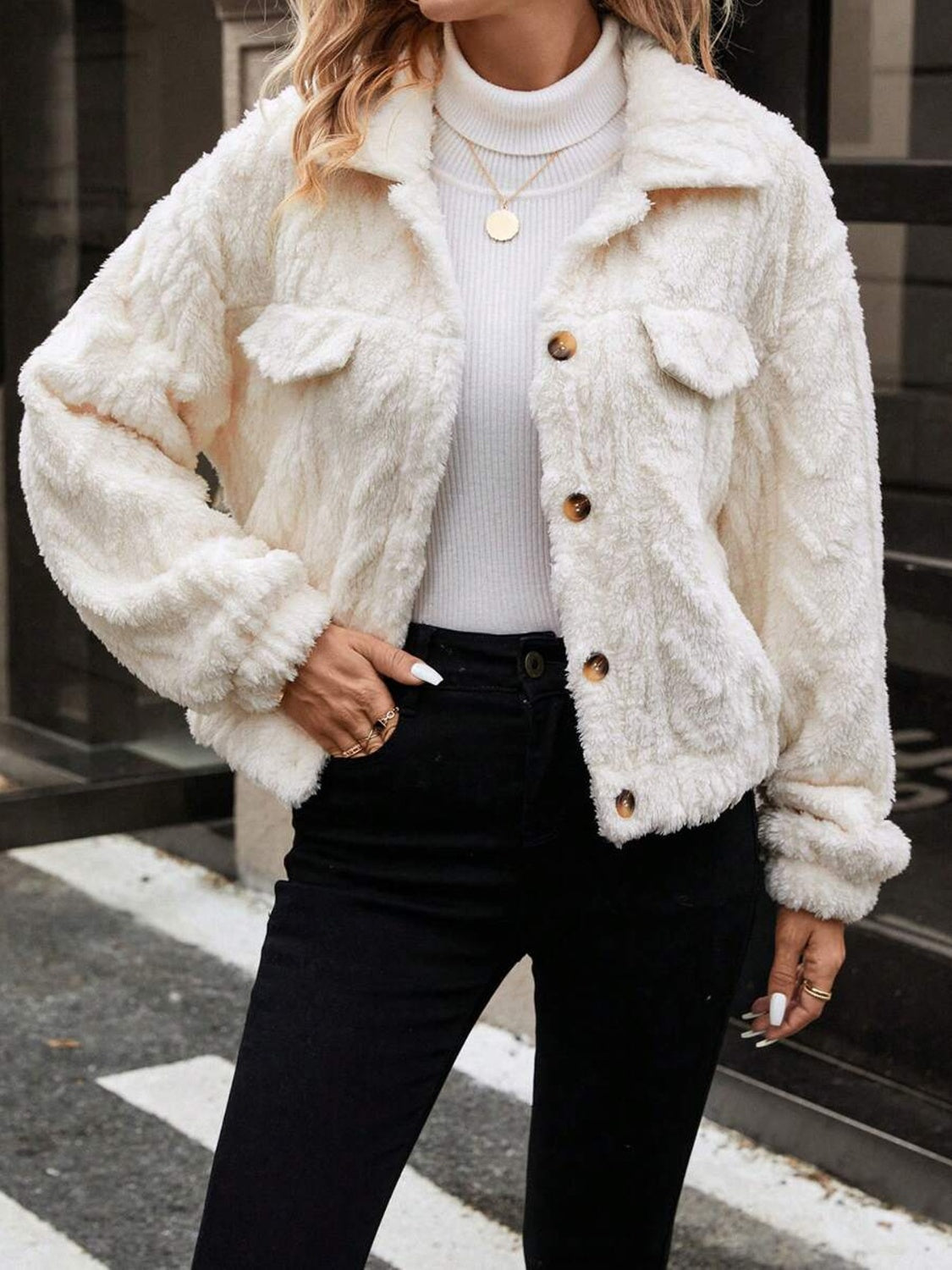 Ivory textured shearling-effect utility jacket with button closures and chest pockets.