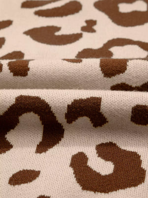 Chic leopard print knit sweater in beige and brown with a textured weave.