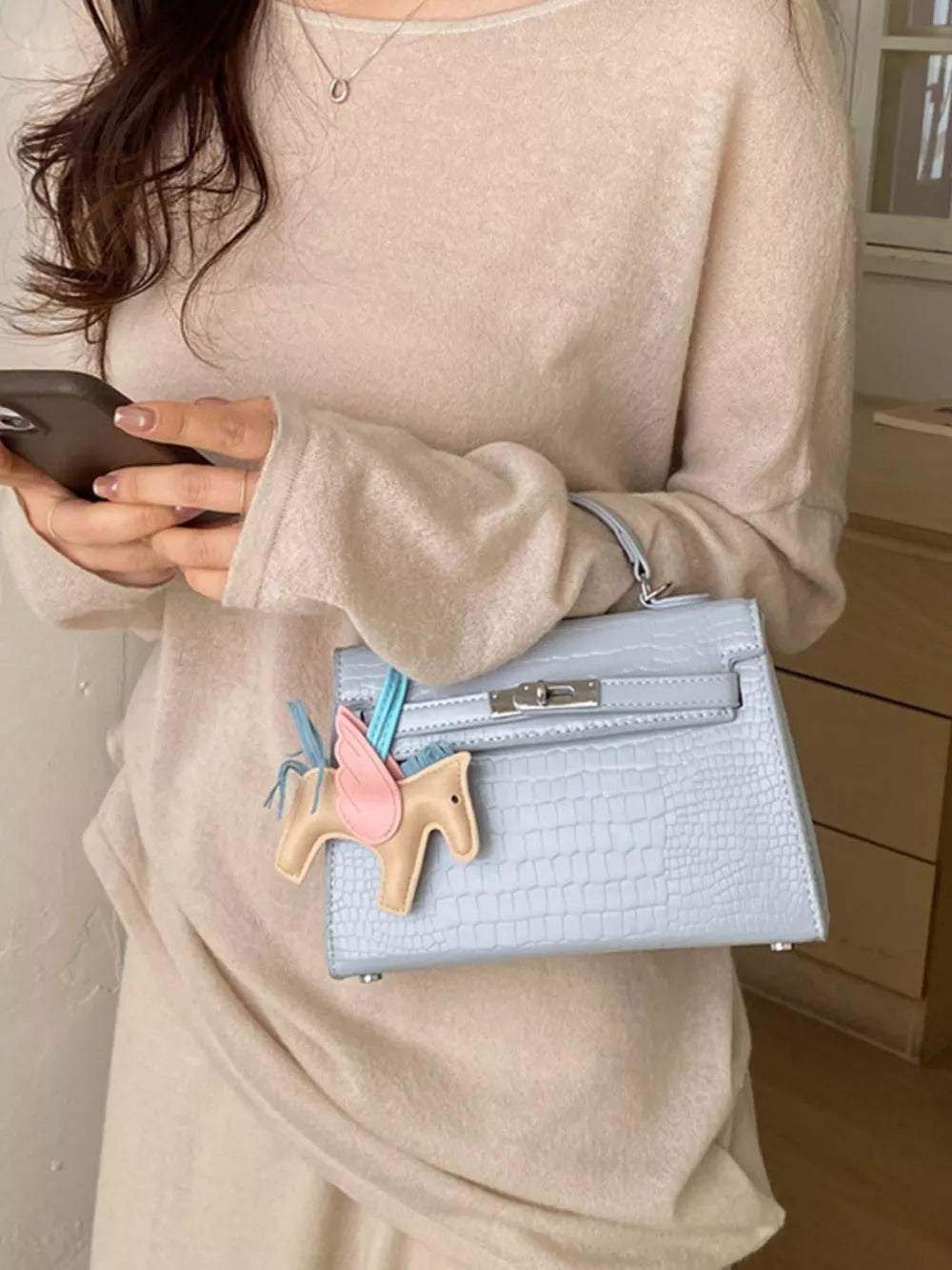 Crocodile Embossed Mini Crossbody Bag in Blue, model styling view