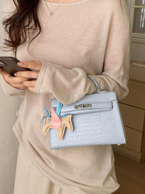 Crocodile Embossed Mini Crossbody Bag in Blue, model styling view
