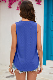 Blue perforated V-neck sleeveless blouse with a diamond pattern detail.