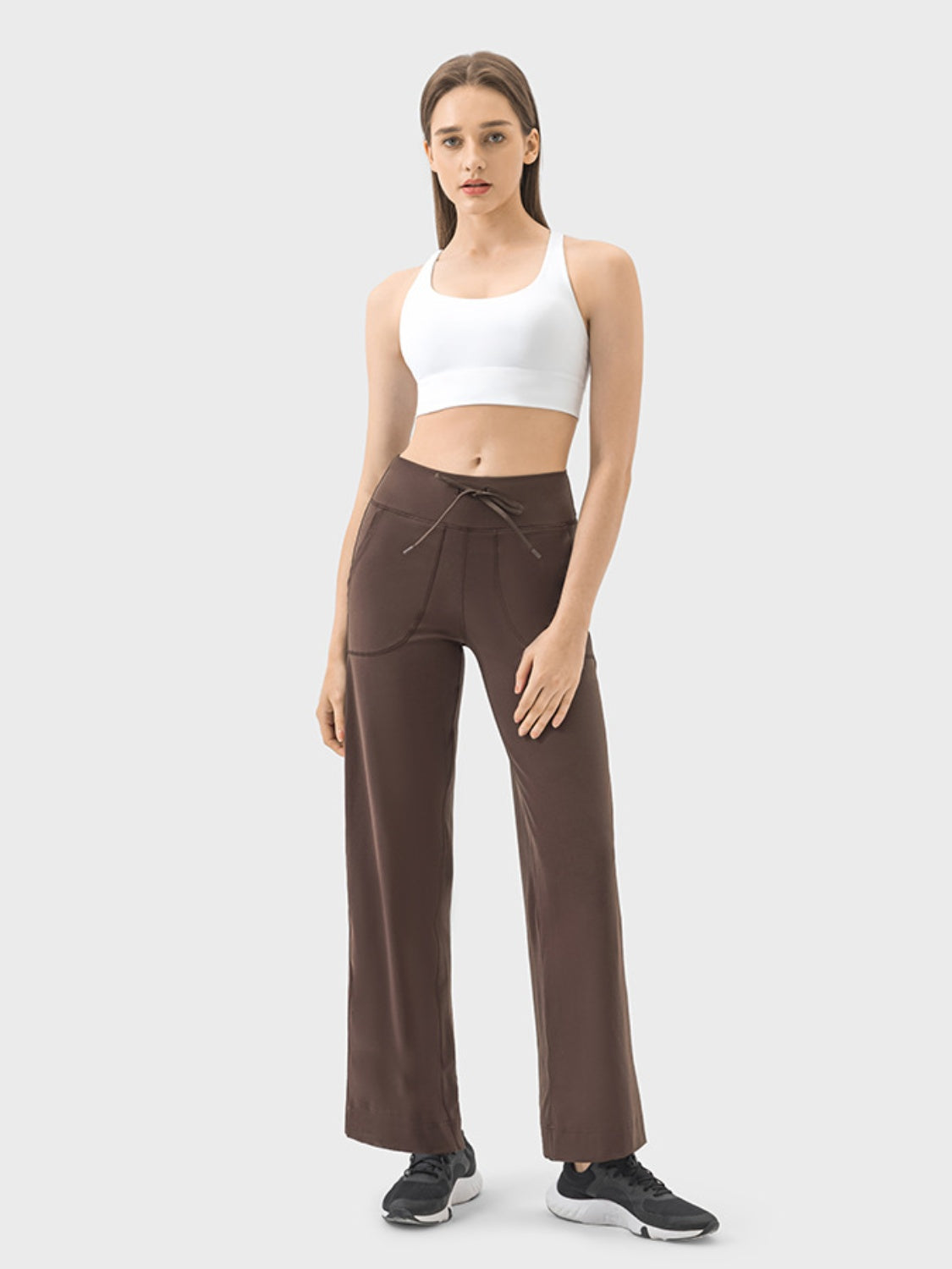 Mocha wide-leg drawstring active trousers with pockets and a relaxed fit.