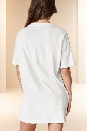 White oversized slouch tee dress with short sleeves and a relaxed fit.