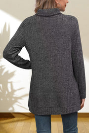 Charcoal ribbed knit turtleneck tunic top with long sleeves and a relaxed fit.