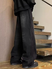 Men's black wide leg jeans with drawstring waist and casual fit.