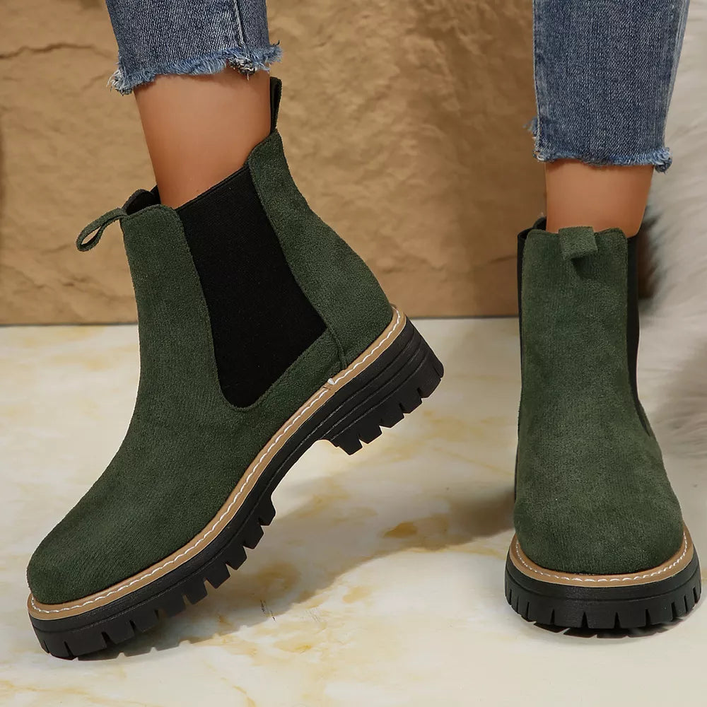 Green suede chelsea ankle boots with chunky sole and elastic sides.
