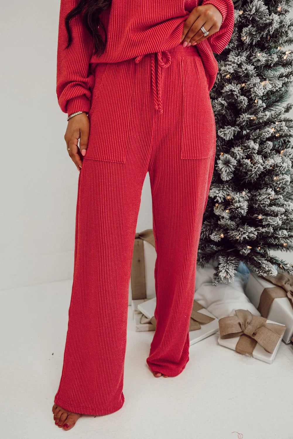 Deep Red ribbed knit lounge pants with drawstring waist and pockets.