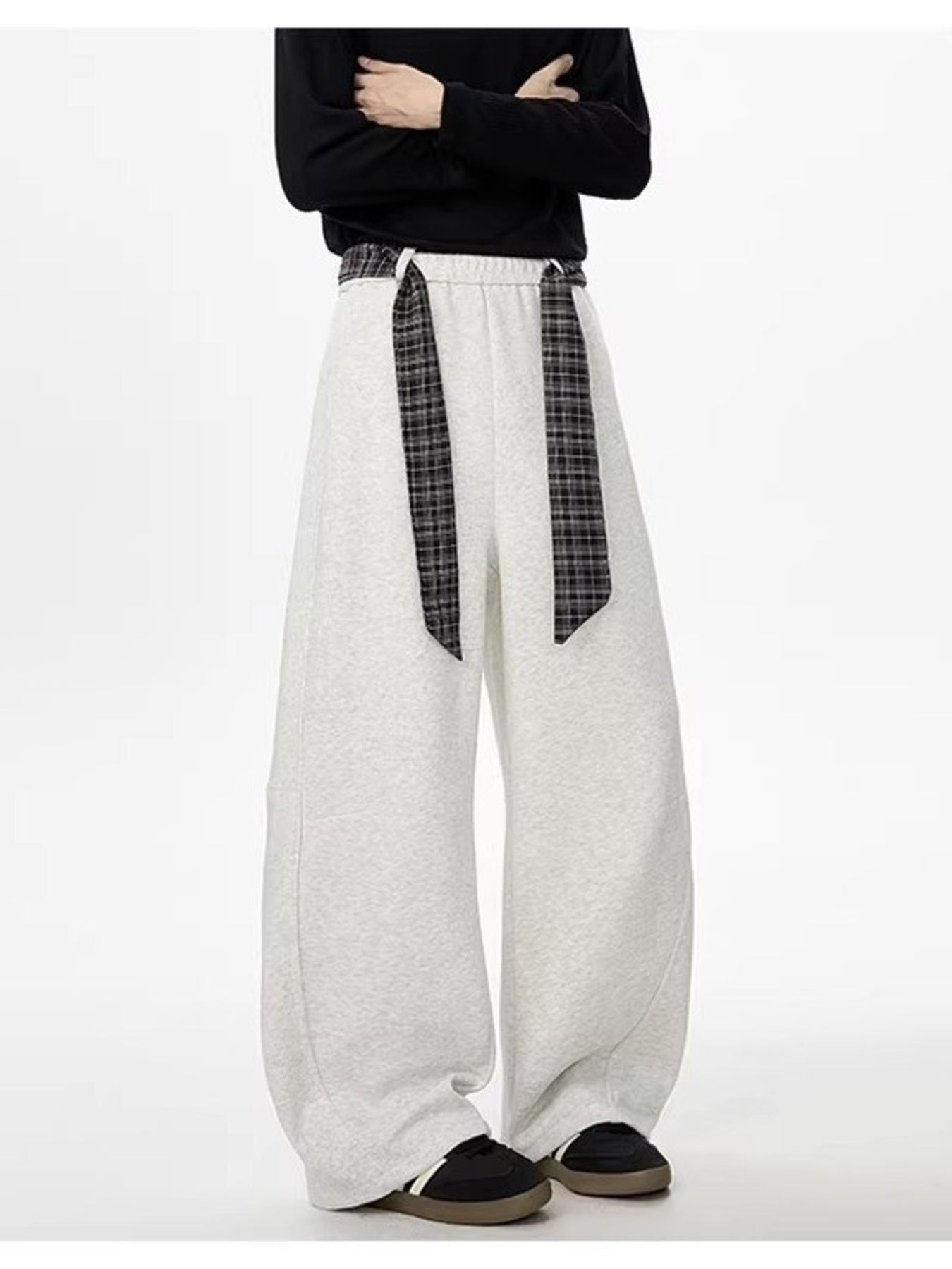 Light gray relaxed fit wide-leg sweatpants with plaid drawstring detail.