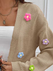 Khaki open-front knit cardigan with embroidered colorful flowers.