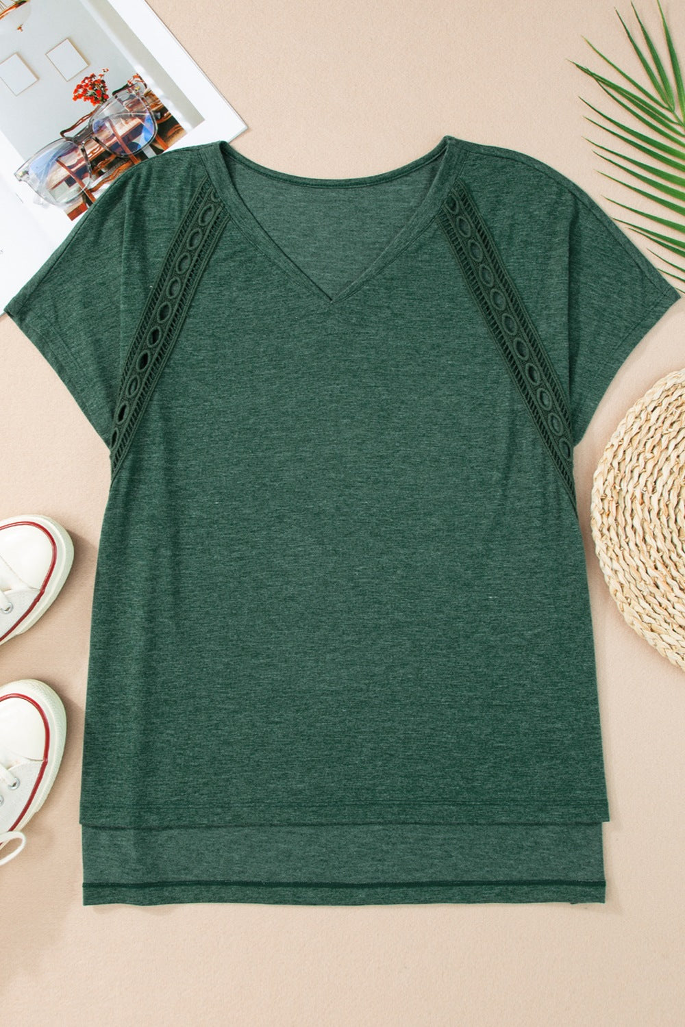 Dark green dolman sleeve tunic with lace inset detail and V-neck