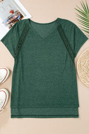 Dark green dolman sleeve tunic with lace inset detail and V-neck