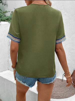 Matcha green v-neck top with embroidered trim on sleeves