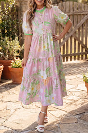 Pink floral tiered midi dress with puff sleeves and green trim