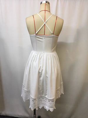 White lace trim mini dress with crisscross straps on back.
