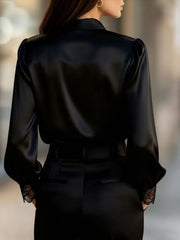 Black satin button-up shirt with balloon sleeves and lace trim cuffs