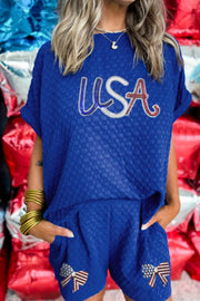 Royal blue textured USA tee and bow shorts set with American flag detail.
