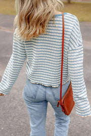 Textured stripe henley sweater in dusty blue with a relaxed fit and bell sleeves.