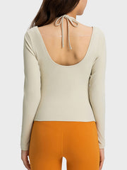 Ivory ribbed long sleeve active top with back tie detail