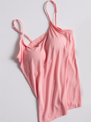 Pink soft-cup cami with adjustable spaghetti straps and a square neckline.