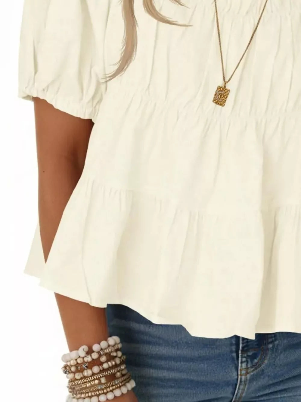 Cream white ruffled maternity blouse with puff sleeves and tiered hem