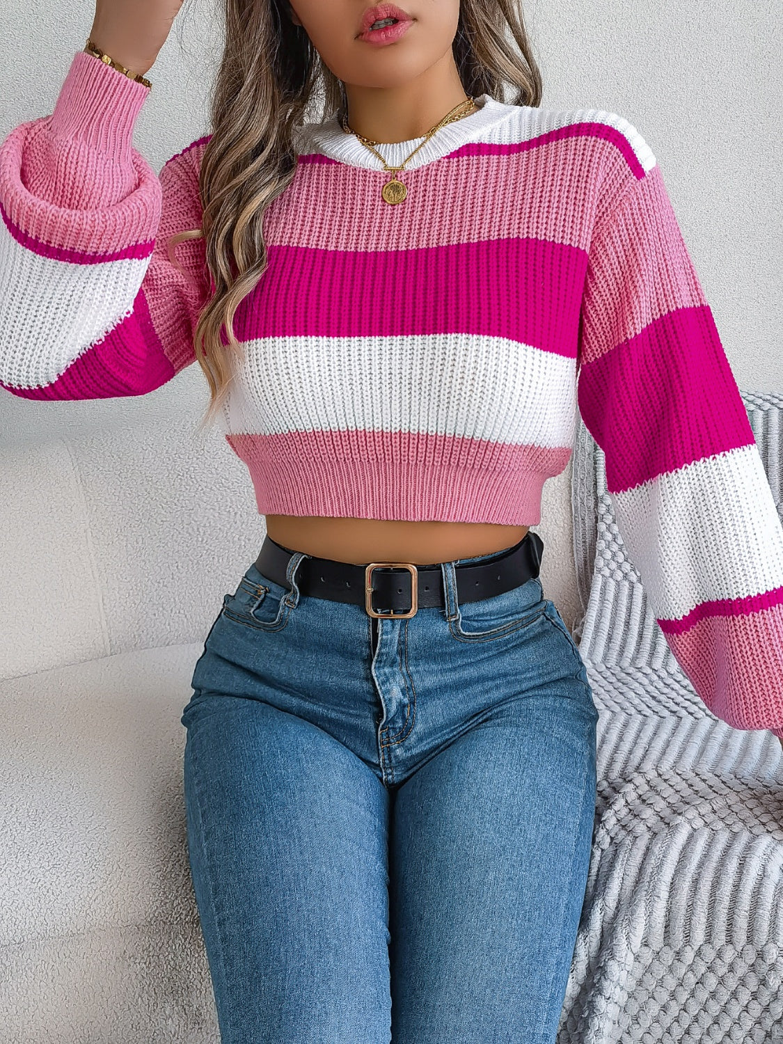 Striped crop knit sweater with balloon sleeves in pink, white, and cerise acrylic.