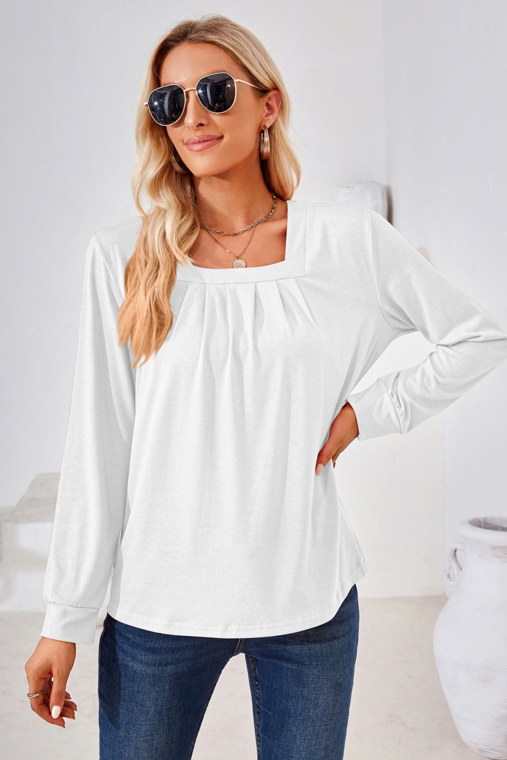 White jersey top with gathered square neckline and long sleeves