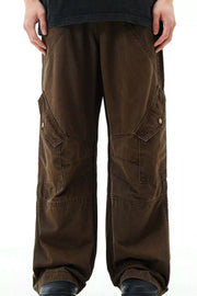 Brown cargo pants with snap pockets and detailed stitching.