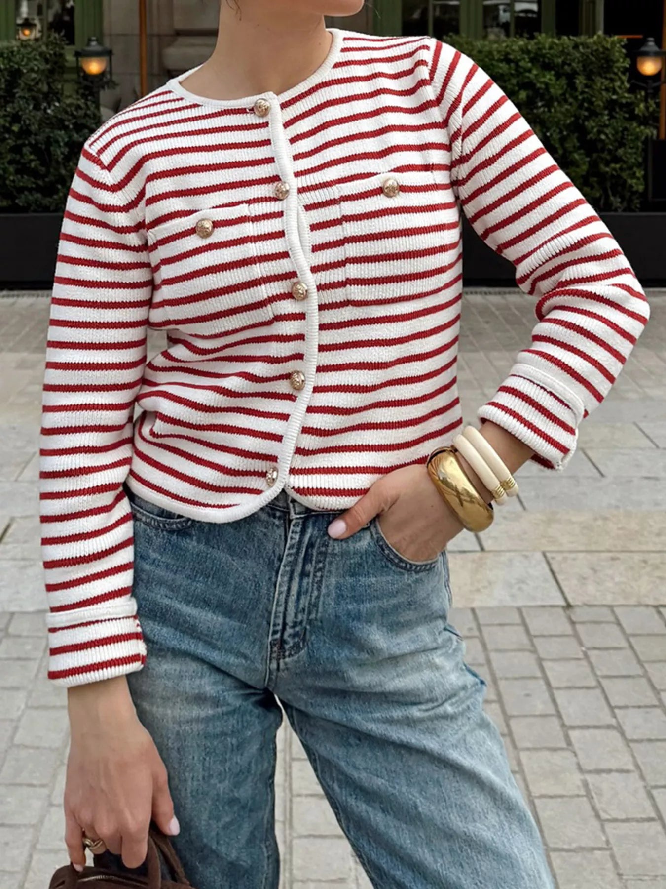 Red and white striped knit cardigan with gold buttons and a crew neck.