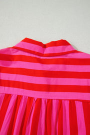 Cotton blend shirt with bold red and pink stripes, featuring a button-down collar and gathered detail.