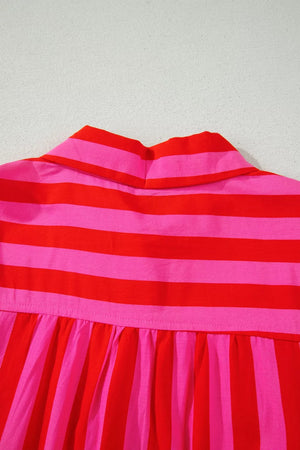 Cotton blend shirt with bold red and pink stripes, featuring a button-down collar and gathered detail.