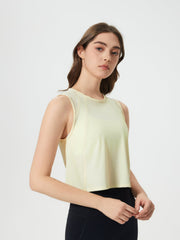 Pastel Yellow mesh-inset back cropped active tank top with crew neck and sleeveless design.