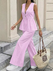 Pink V-neck sleeveless peplum top with button and wide-leg pants set.