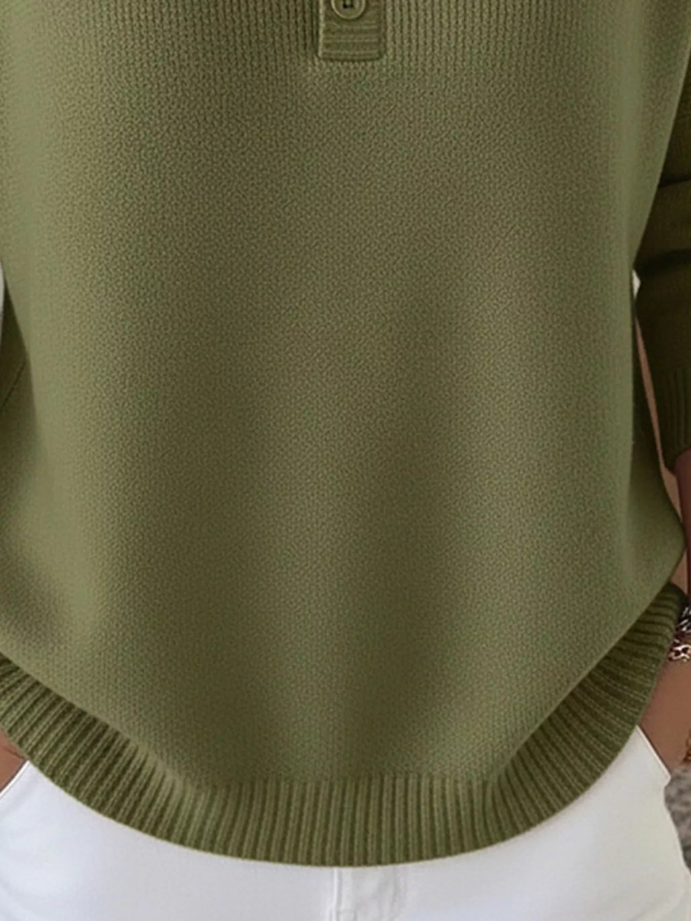 Army green knit top with button detail and ribbed hem