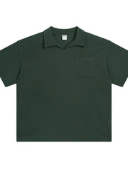Dark green boxy knit polo shirt with a patch pocket and spread collar.