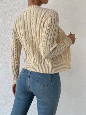 Khaki cable-knit button-front cardigan with open knit details on sleeves.