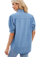 Medium wash denim button-down blouse with puffed short sleeves and button cuffs.