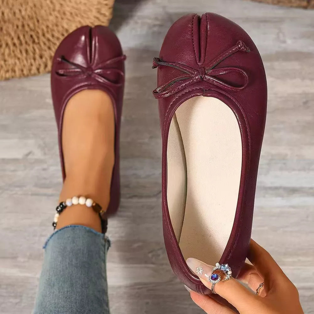 Burgundy tabi slip-on flats with bow detail and split toe.