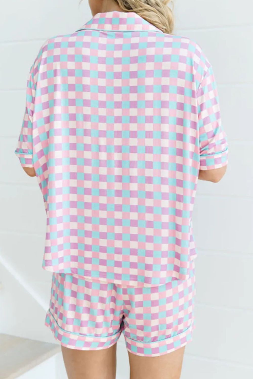 Pastel checkered pajama set with collared short sleeve top and shorts.