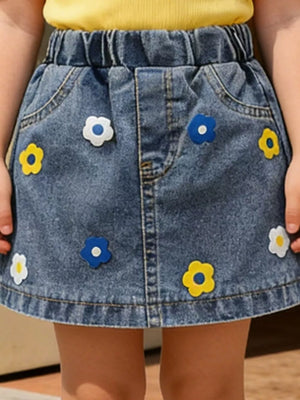 Denim A-line skirt with elastic waist and colorful flower appliqus.